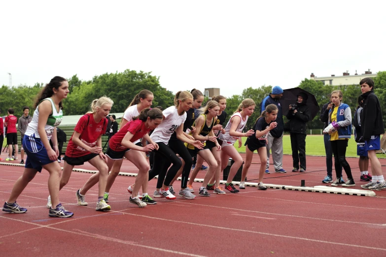 a group of people on a track in line