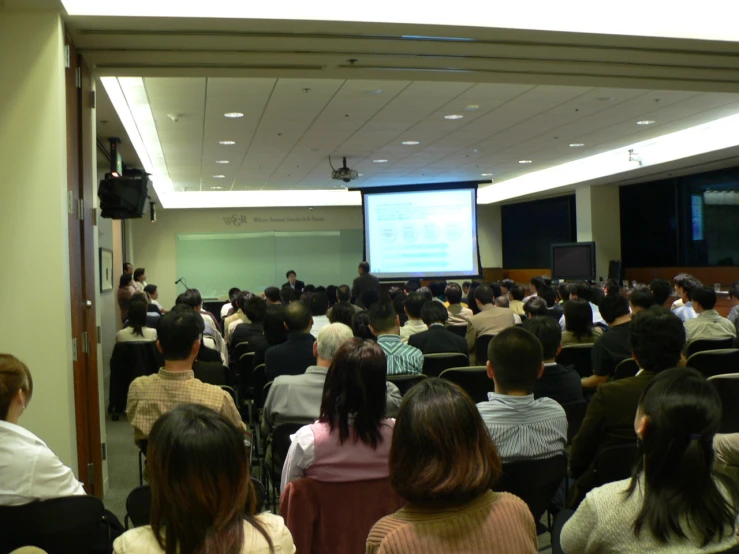 an audience is in the room listening to a presentation