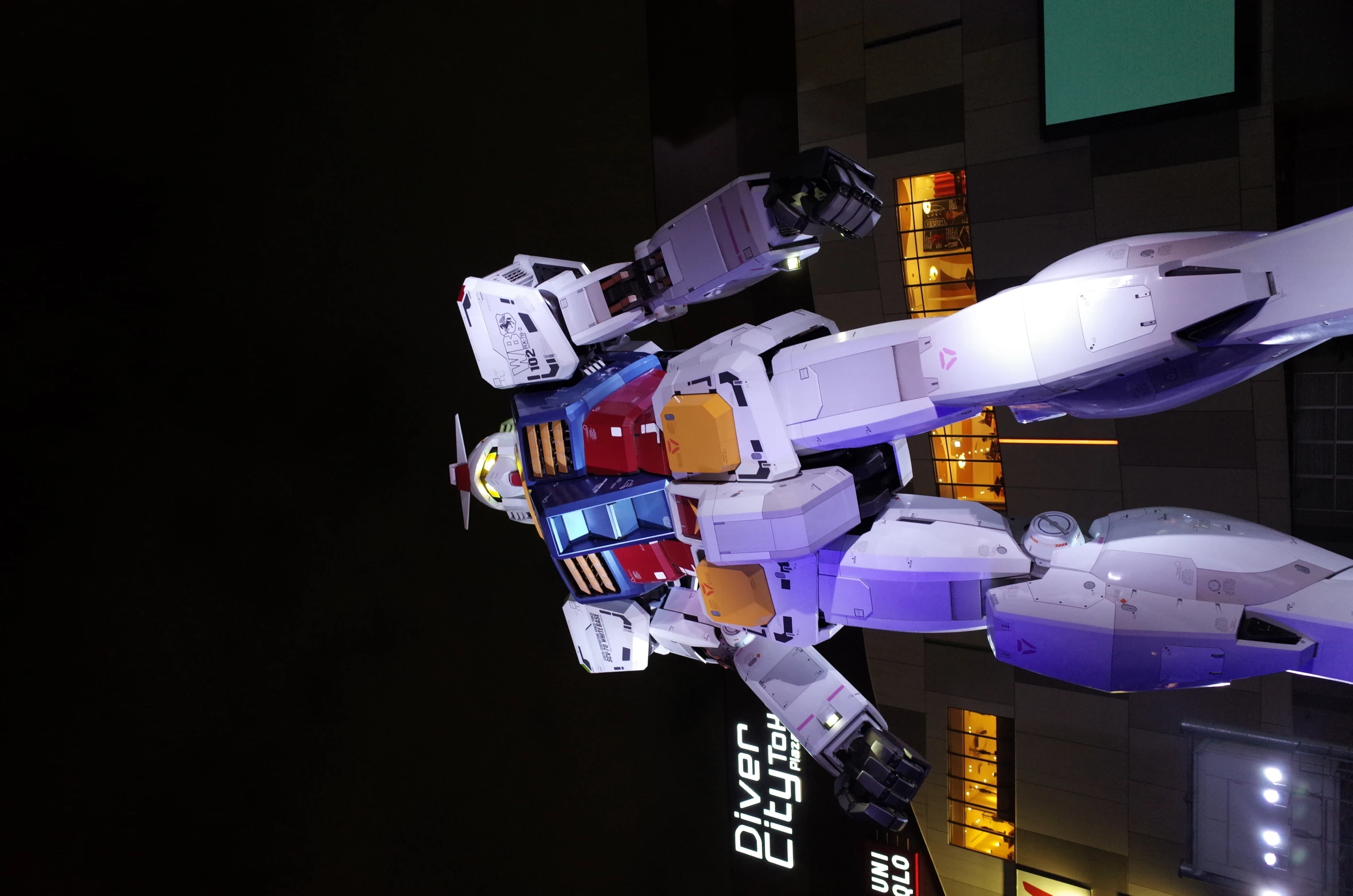 giant robot sculpture of white color in night time