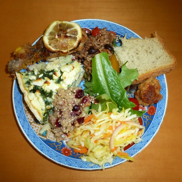 a blue plate topped with different types of food