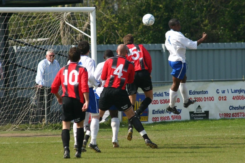 several soccer players play together on a field