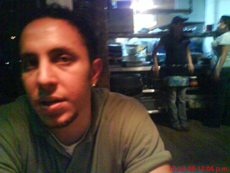 man in a restaurant staring at the camera