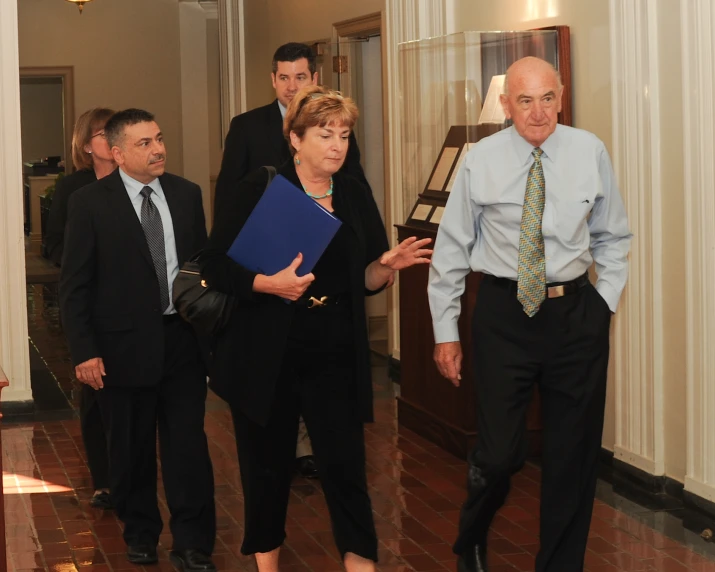 group of people walking around in a room