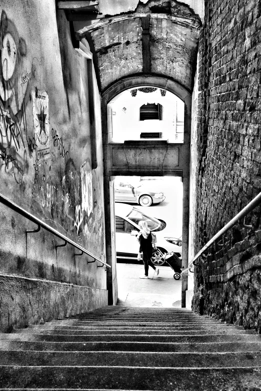 a black and white picture of stairs leading up to a building