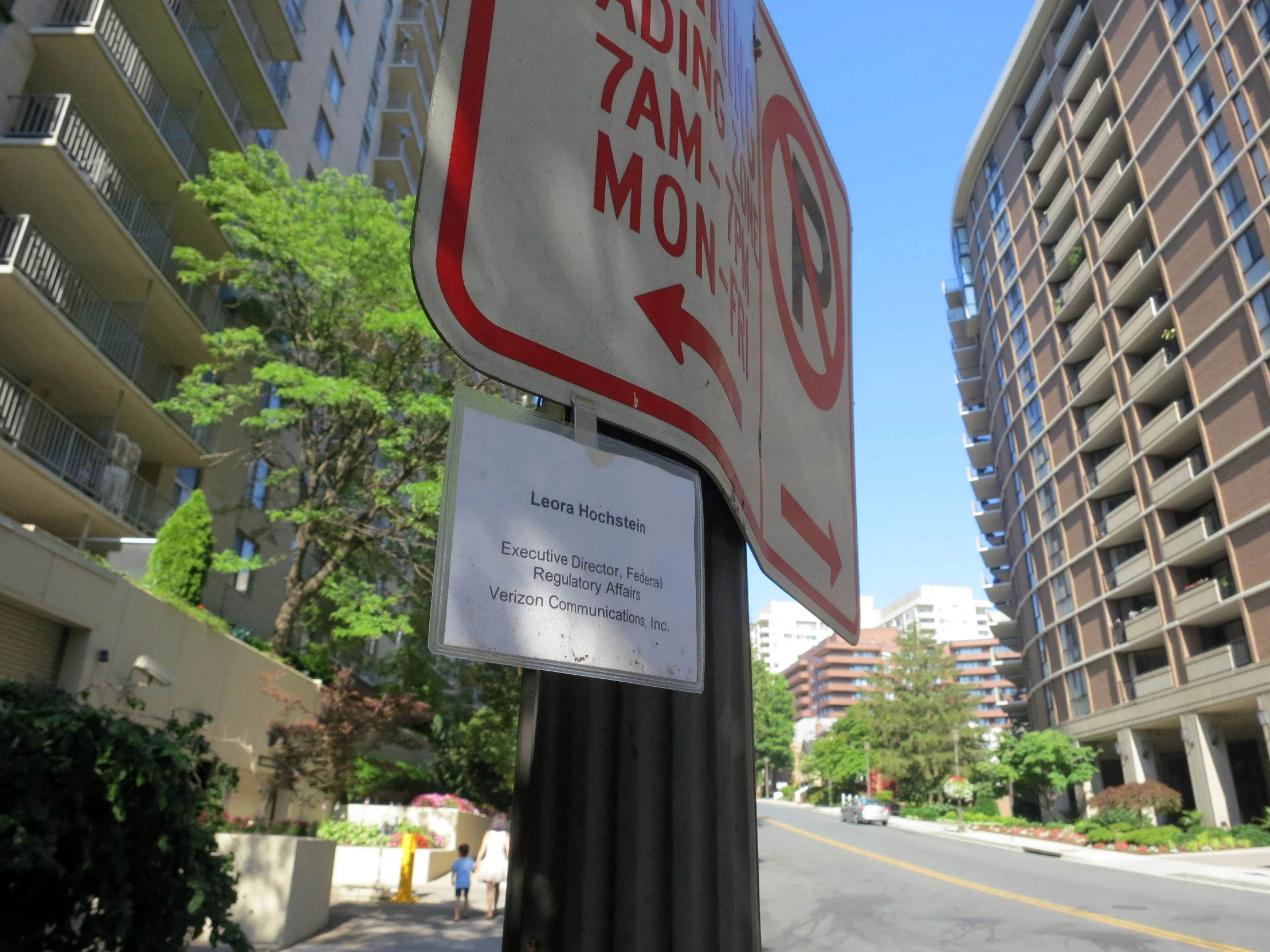 a street sign posted in a city for people to cross