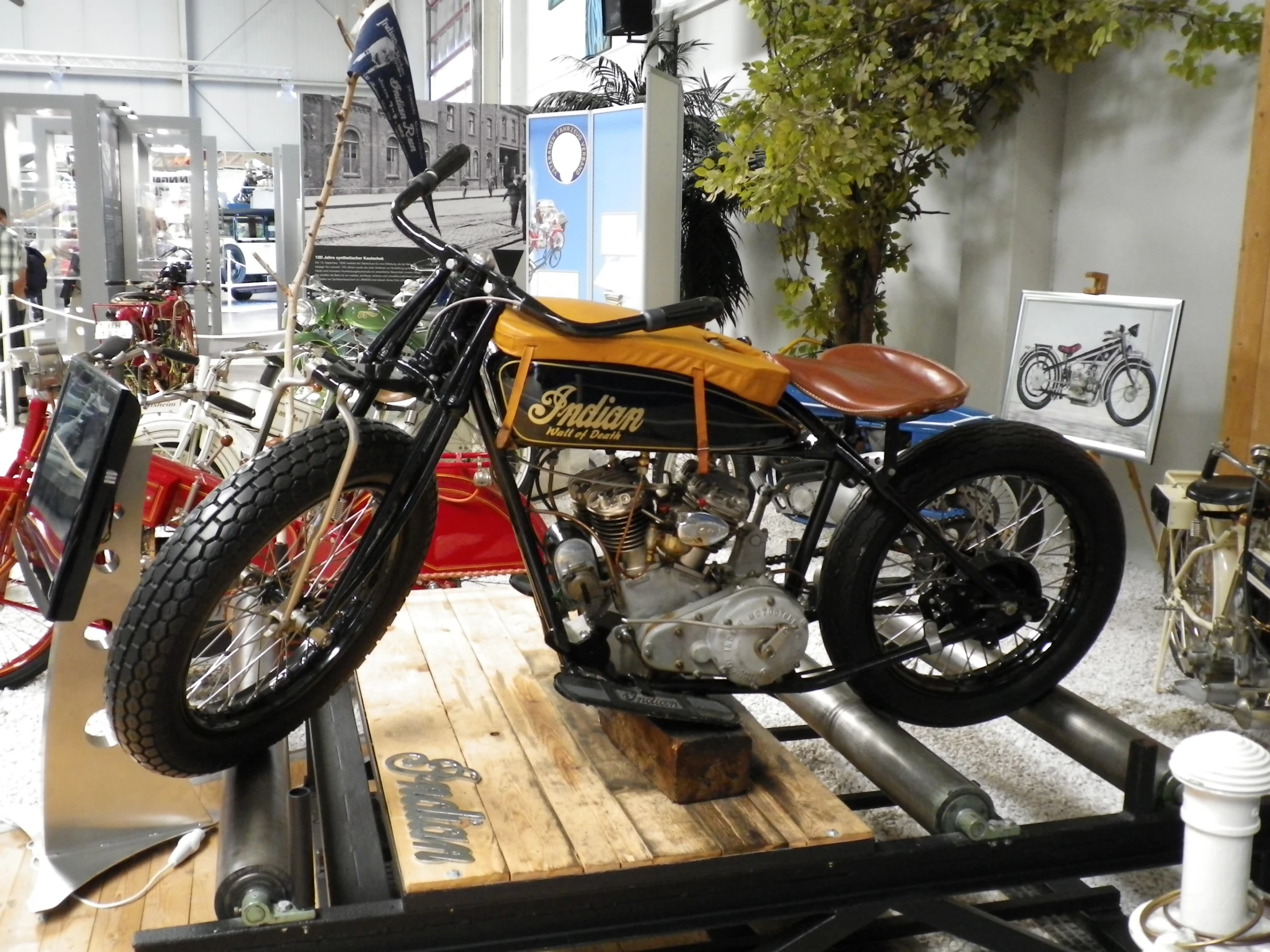 a motorcycle parked in a store with the bottom section extended