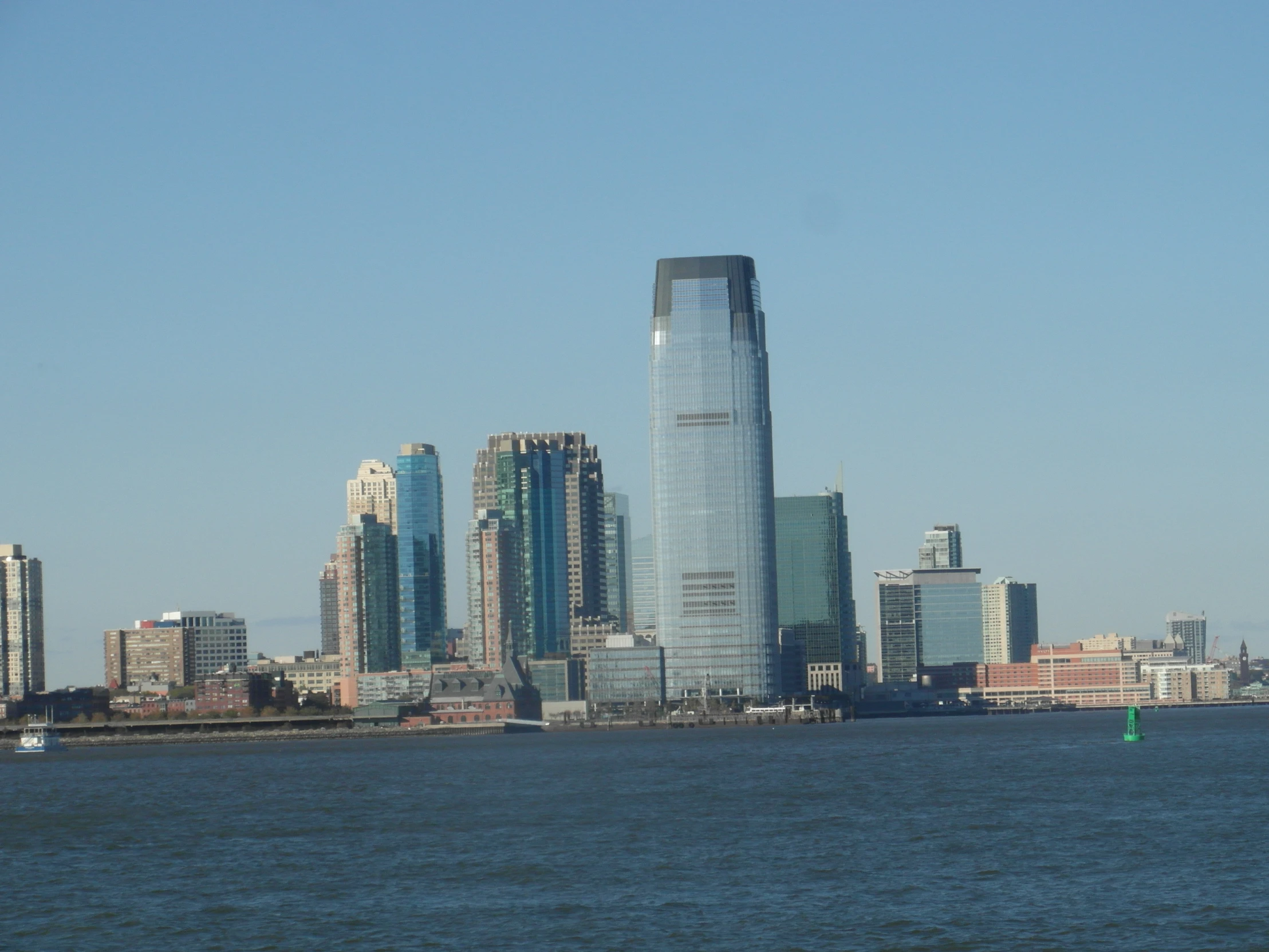 the skyline of a large city overlooking a body of water