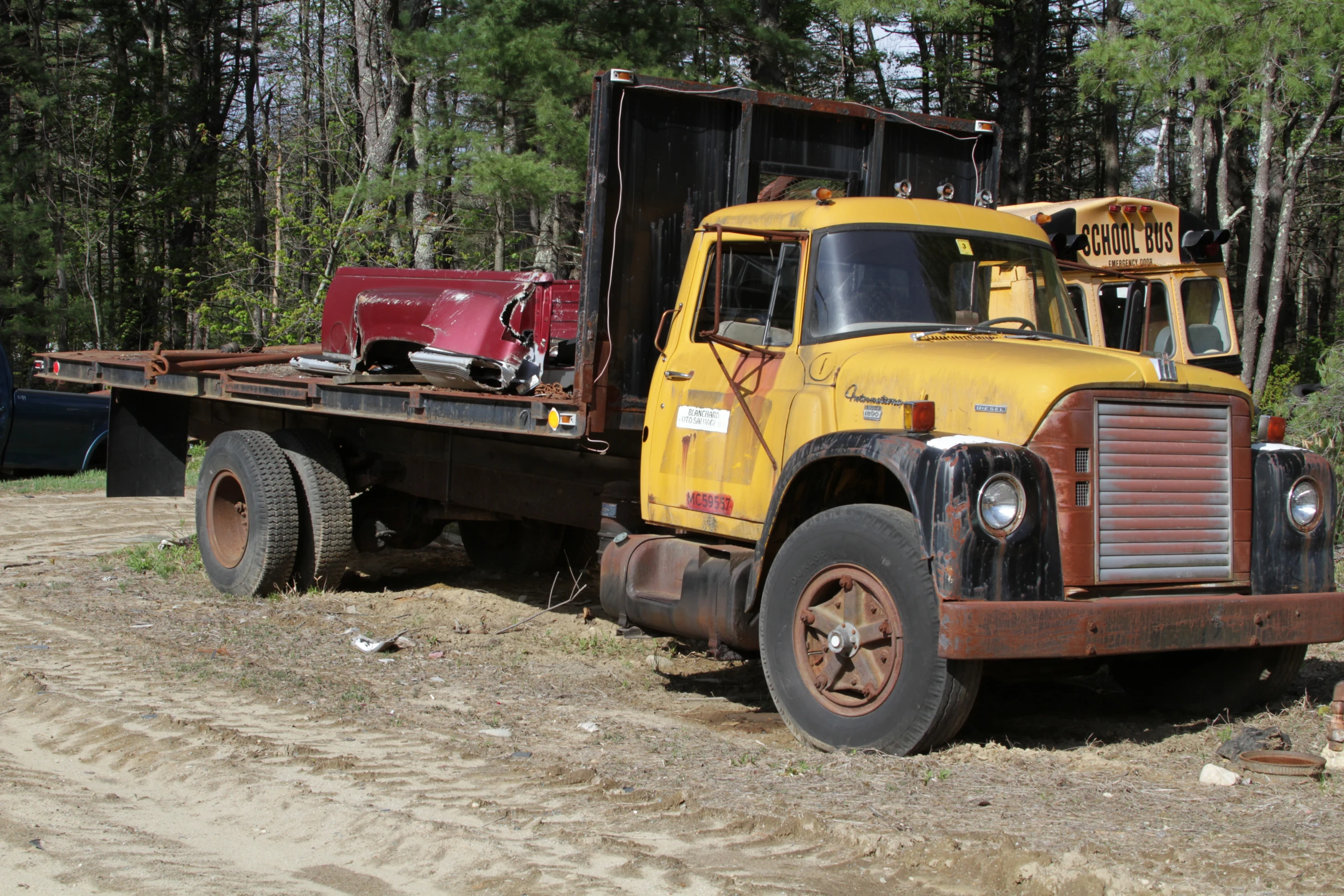 an old rusty looking truck with its cab extended