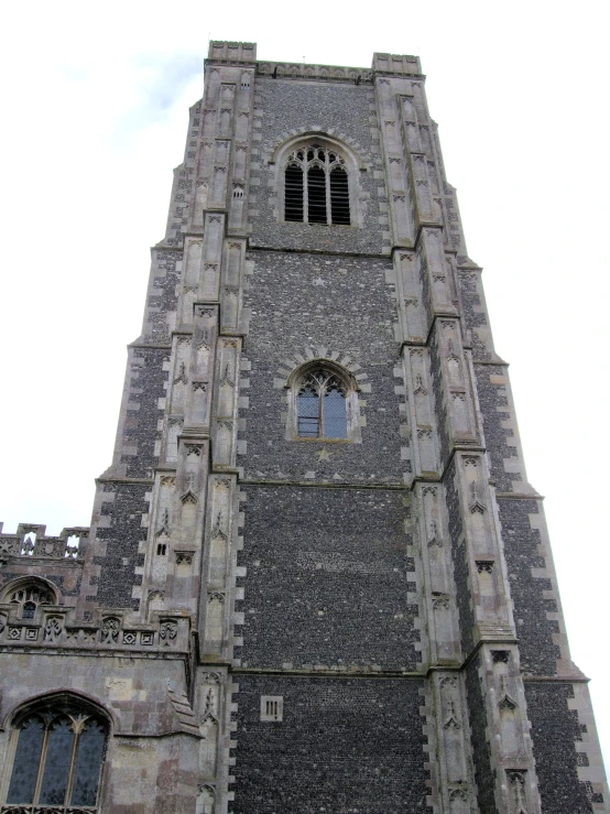 a large tall building with windows on each of it's sides