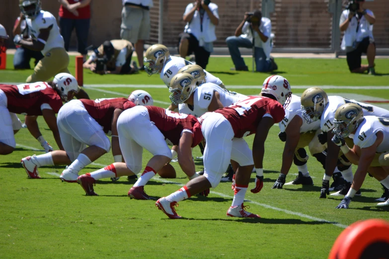 several football players are lined up on the field