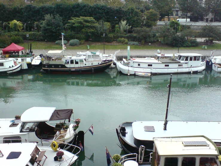 a couple of boats sitting in the middle of a river