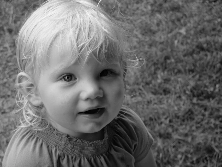 black and white po of a toddler girl looking up