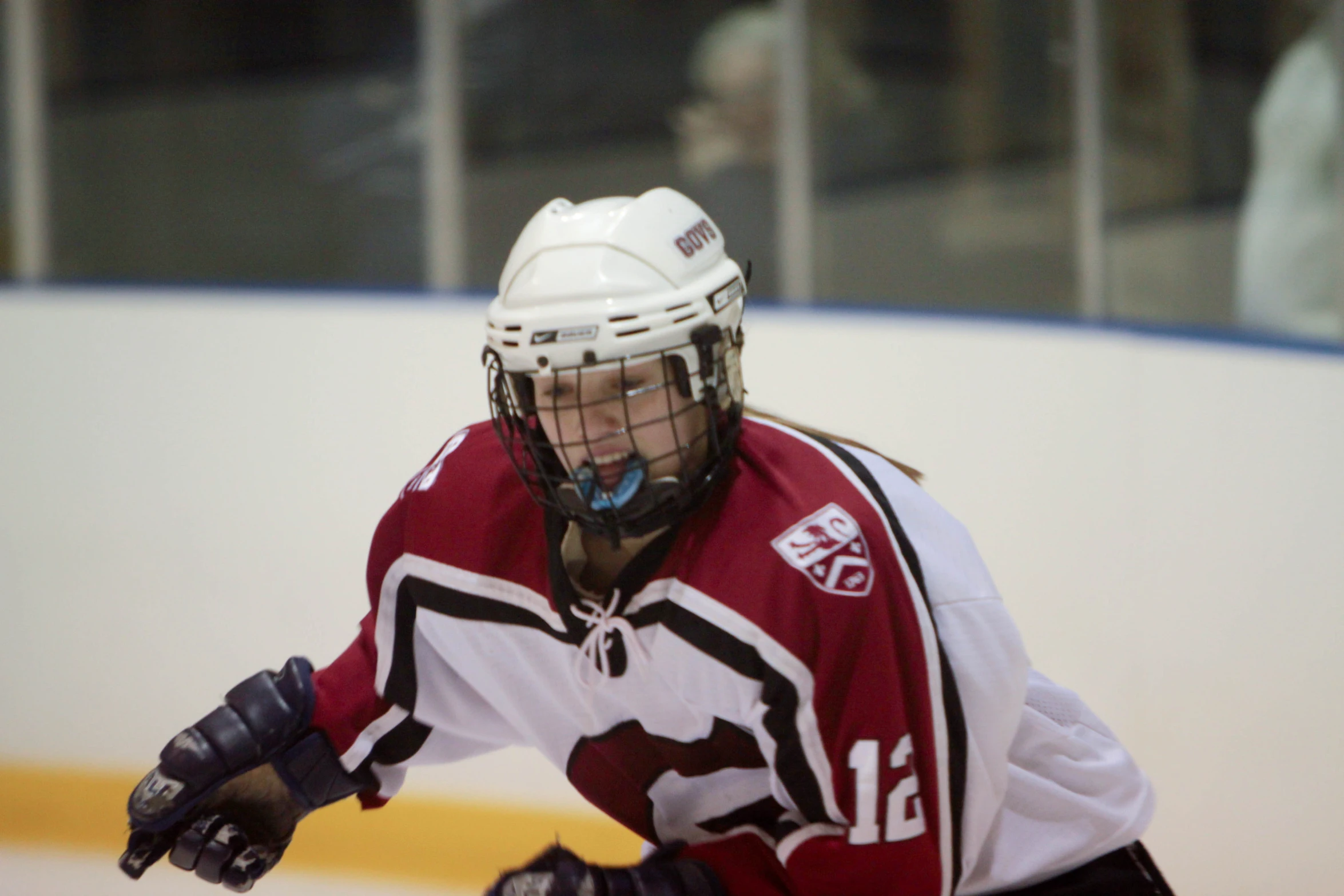 a close up of a person wearing hockey uniform