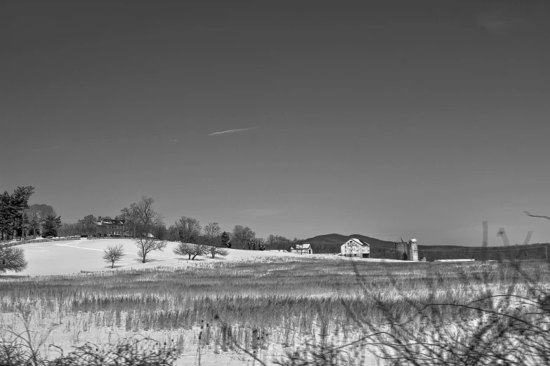 the view of a snowy field with the sky in the background