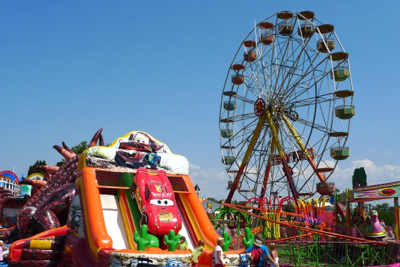 a fair ride with a carnival float and carnival clown rides