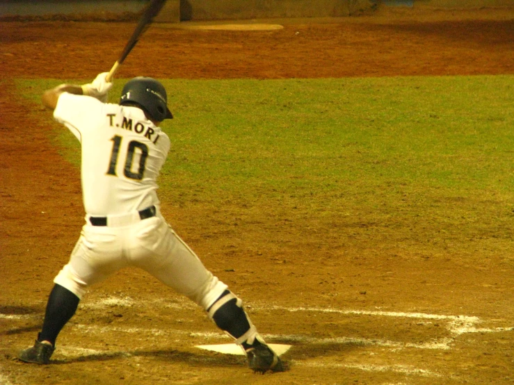 the baseball player is swinging his bat during a game