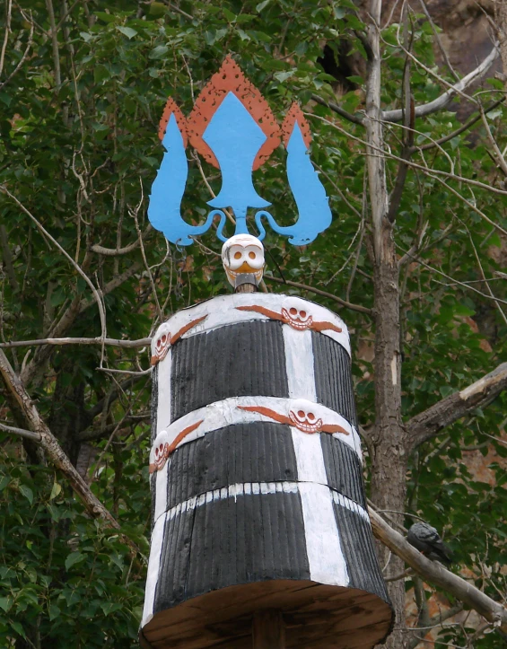 a decorated tower with a bird perched on top