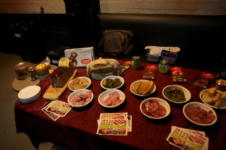 a table covered in different bowls with food on it