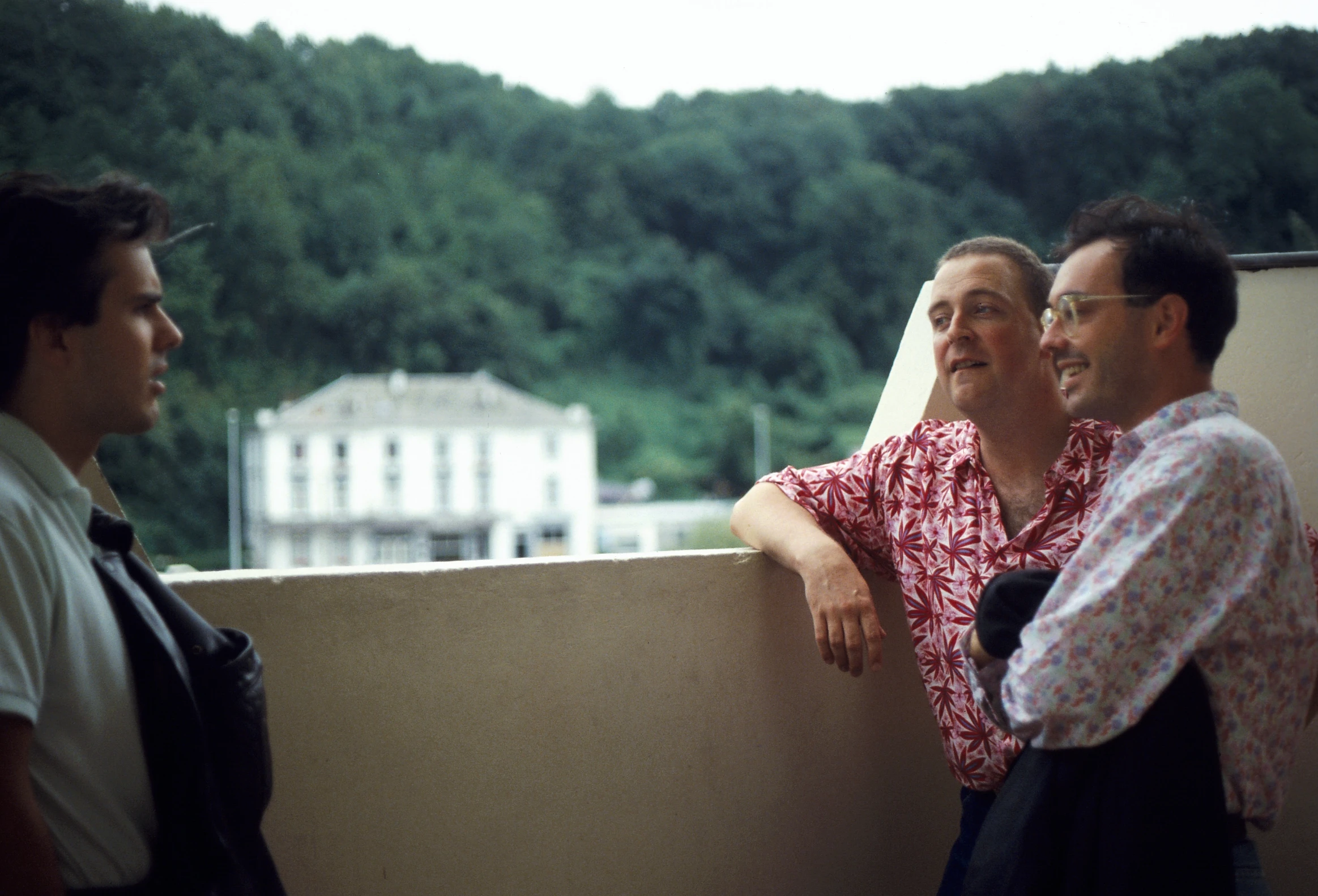 three men are hanging out together and taking a break