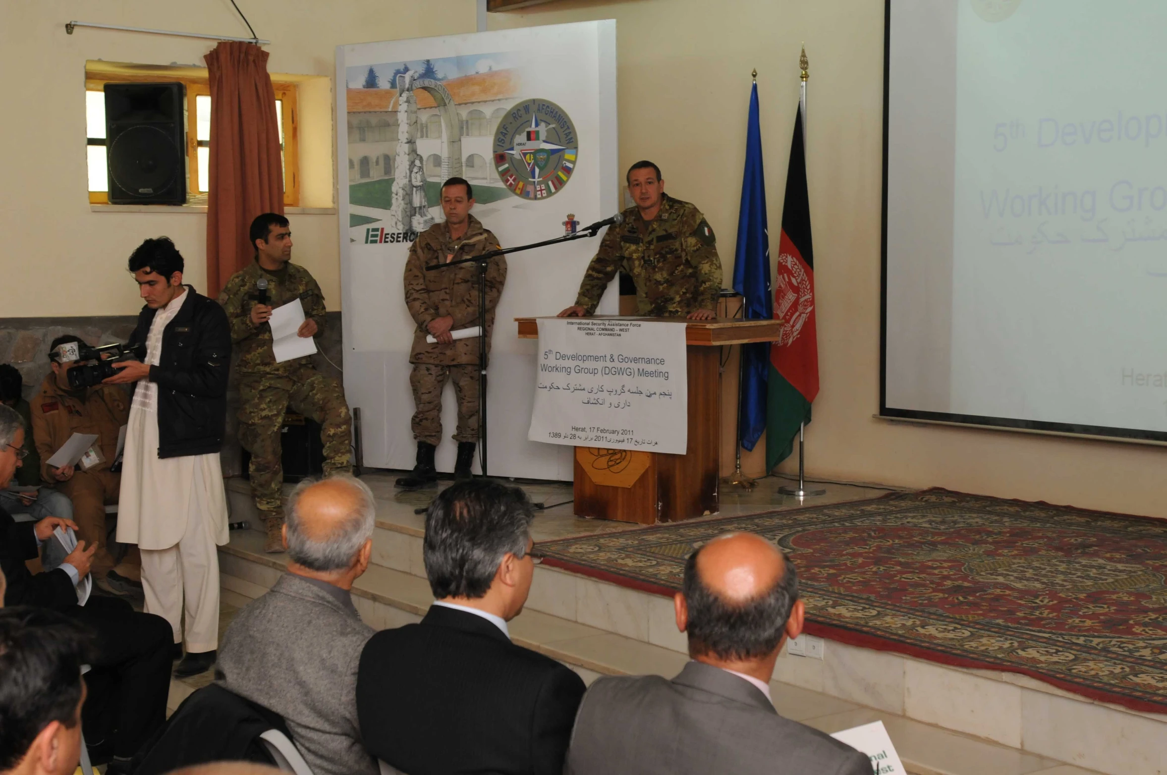 some military personnel are standing at podiums