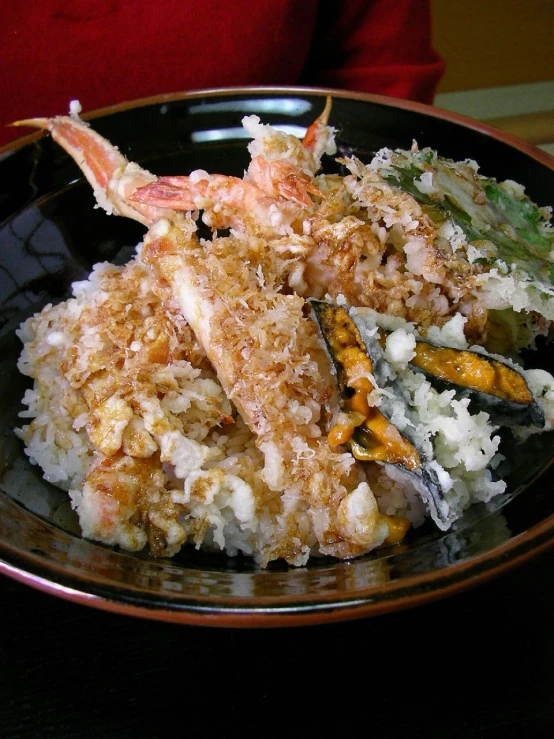 a plate filled with rice, asparagus and other items