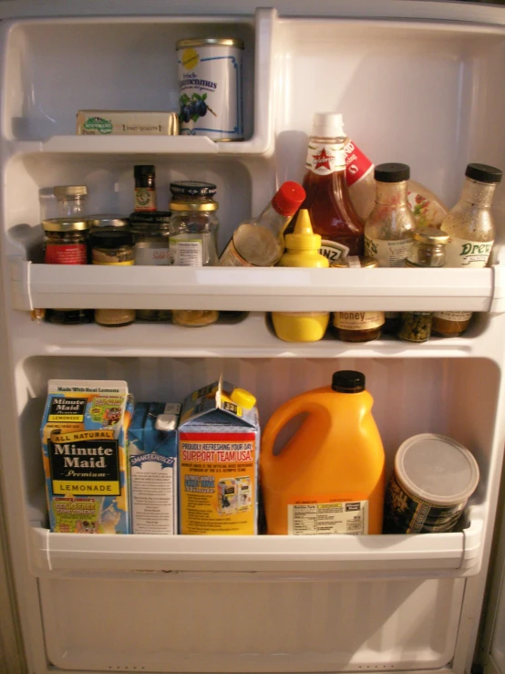 an open fridge filled with lots of food and condiments