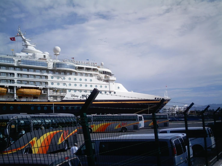 the carnival ship is docked at the dock