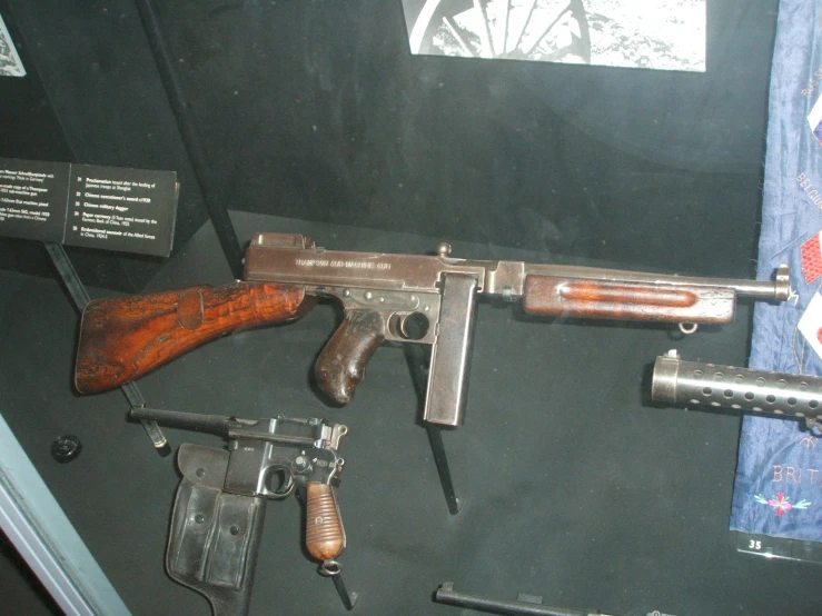 weapons and equipment are on display at a museum