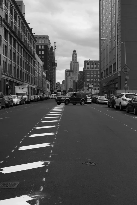 black and white pograph of city street with cars