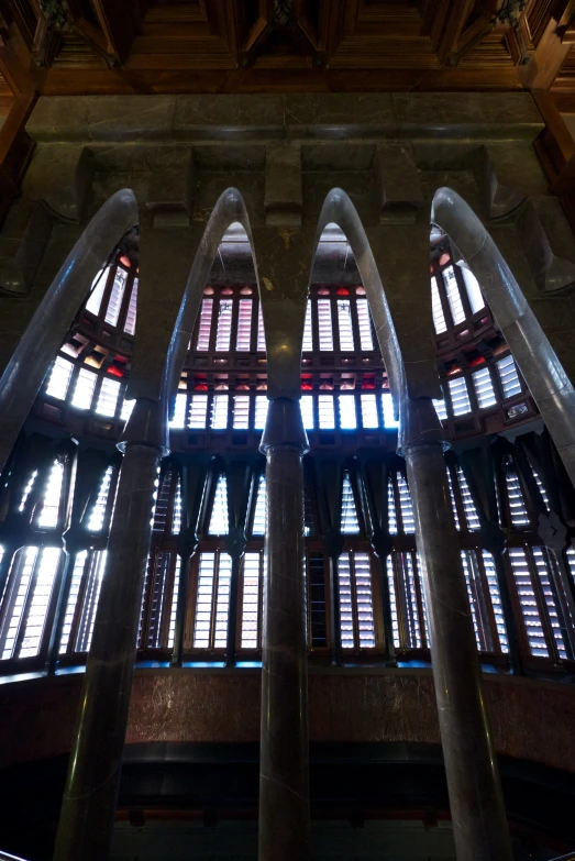 a tall building with several windows and tall columns