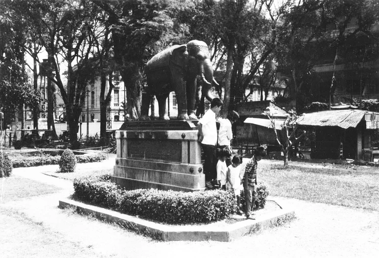 an old po shows a monument and elephants