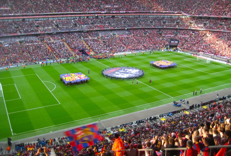 a soccer field with some flags being arranged on it