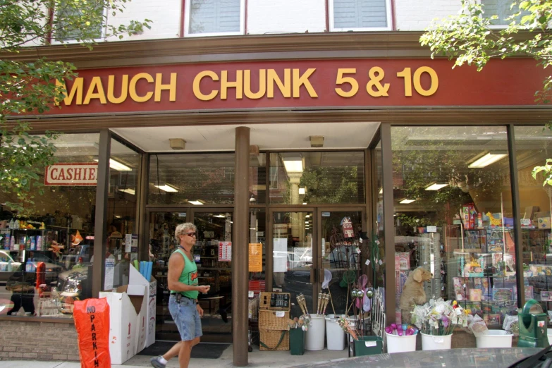 the front of a market with many items in it