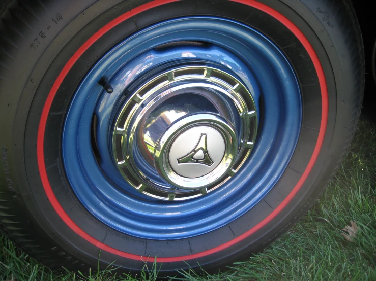the blue, red and black tire has a clock on it
