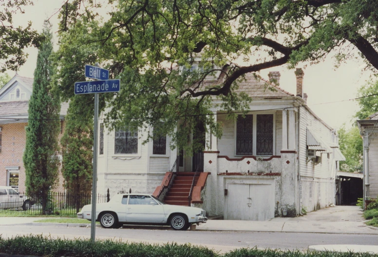 the house is next to the street and has two balconies on it