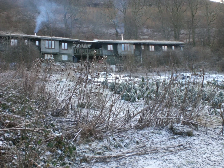 the fire is coming out from the back of the house