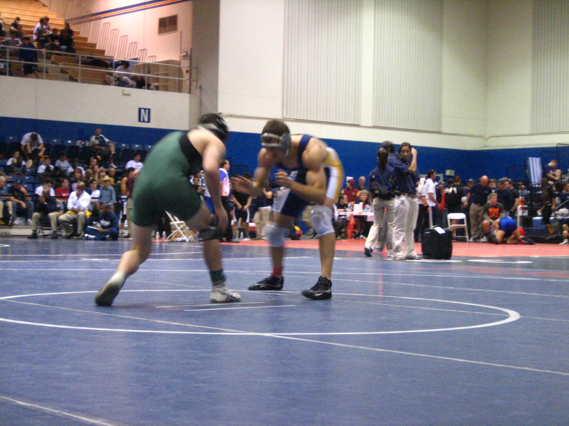 two wrestlers at the end of a wrestling match