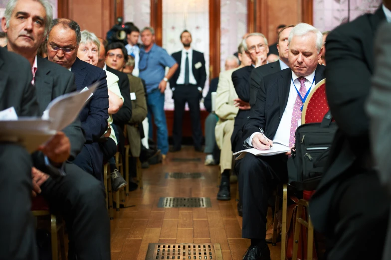 an image of people that are sitting in the same room