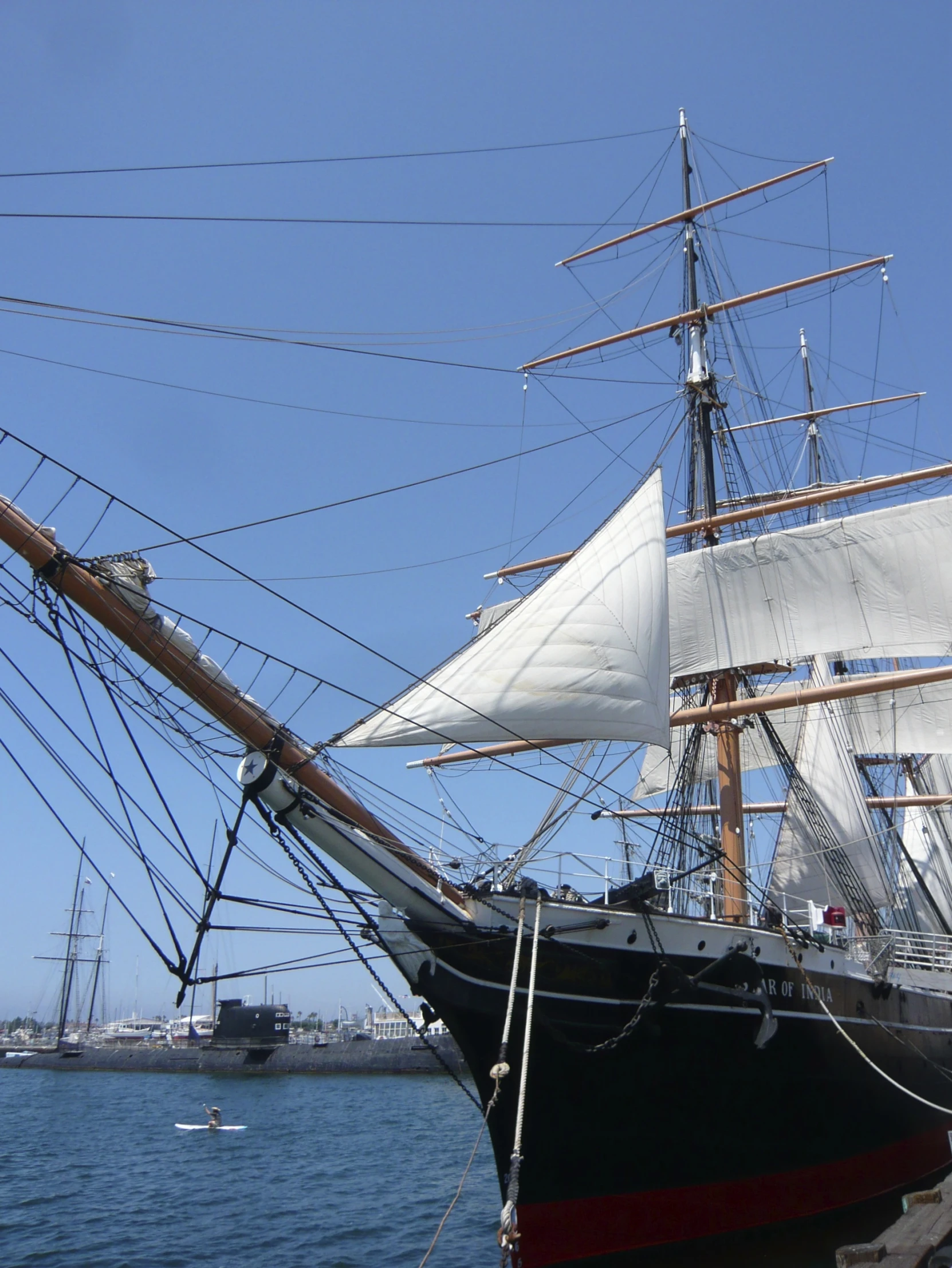 an old sailing ship docked in the ocean