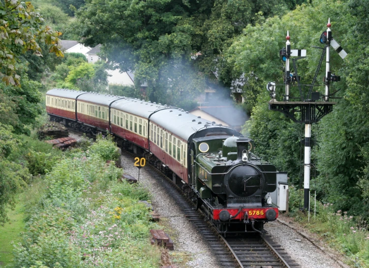 a steam engine train on a train track
