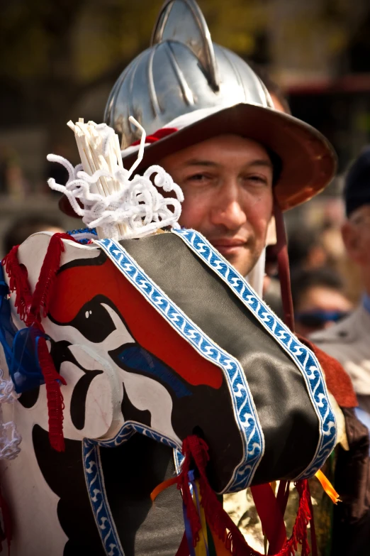 a man in costume riding a horse with a helmet