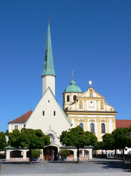 the large cathedral has two green steeples