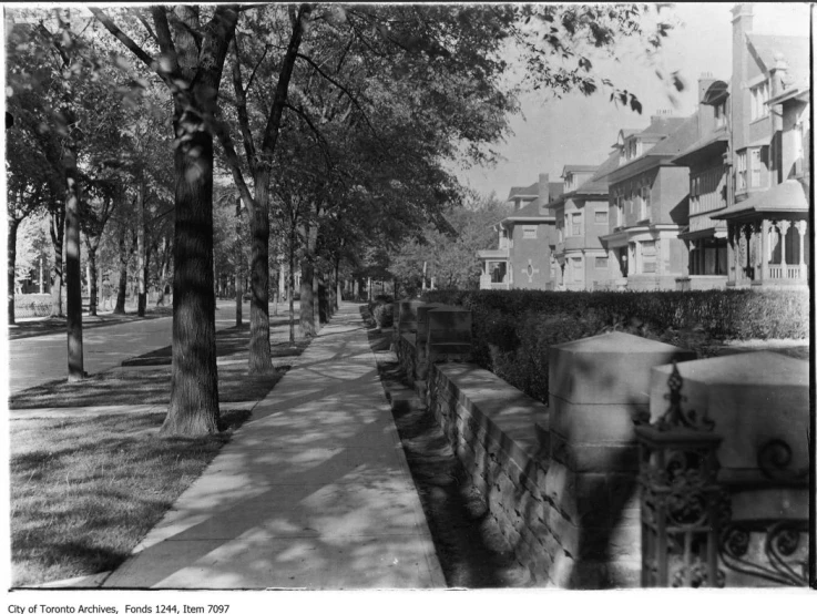 row of townhouses along a brick road in a city