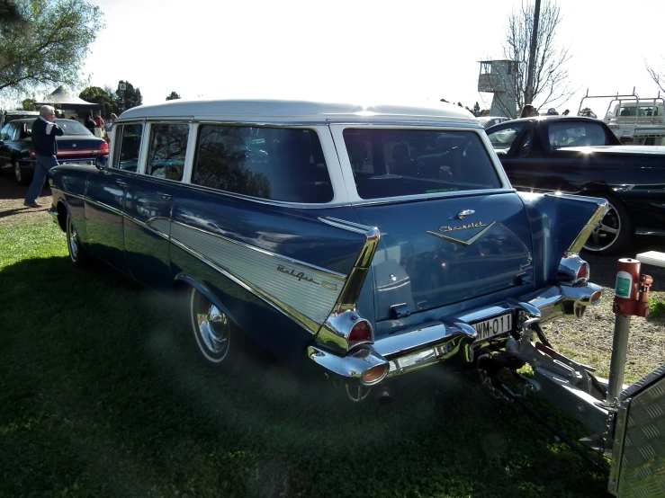 this car has been painted in blue with white stripe on the back