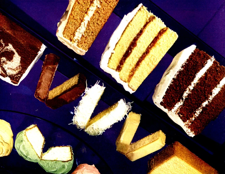 five pieces of a cake sit on display in a blue tray