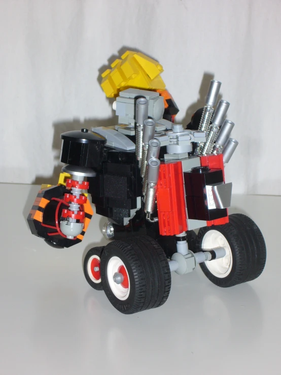 a lego car with a big wheel and big wheels on it