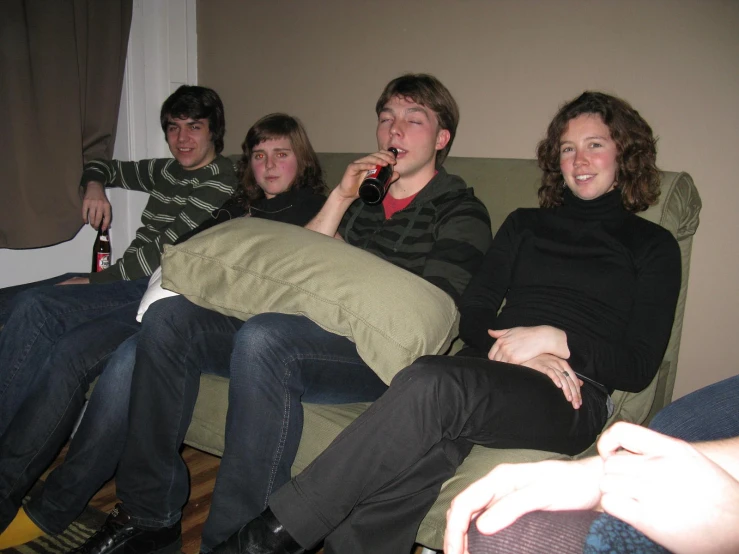 a group of people on a couch talking