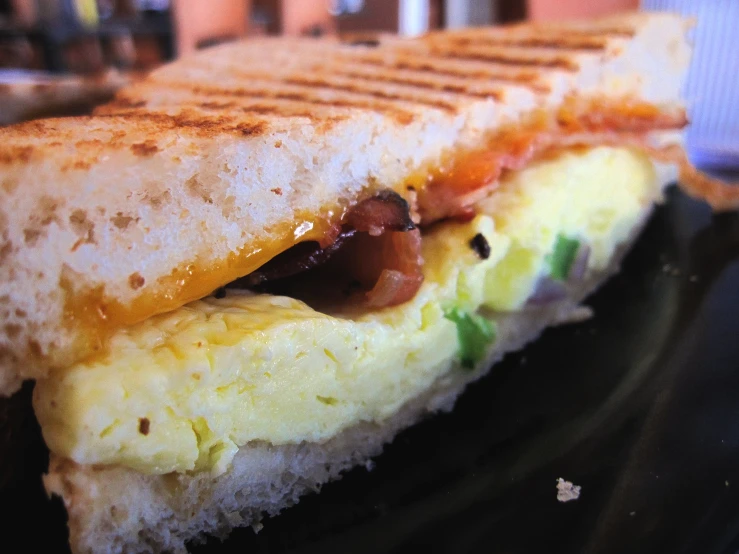 an omelet sandwich is shown with scrambled eggs