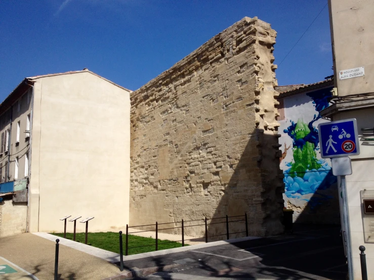 an old building sitting next to a cement building