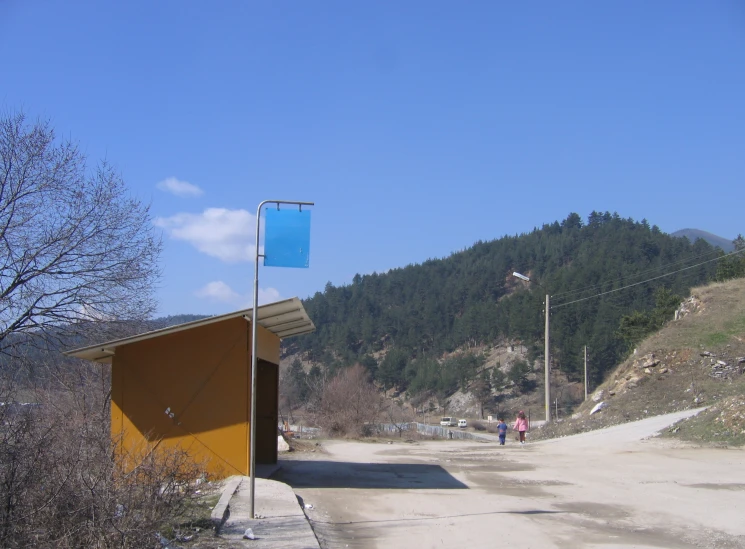 some small buildings on a dirt road